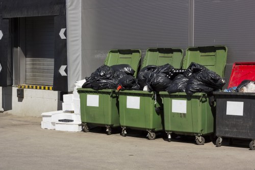 Recycling bins and separated waste at a local transfer station